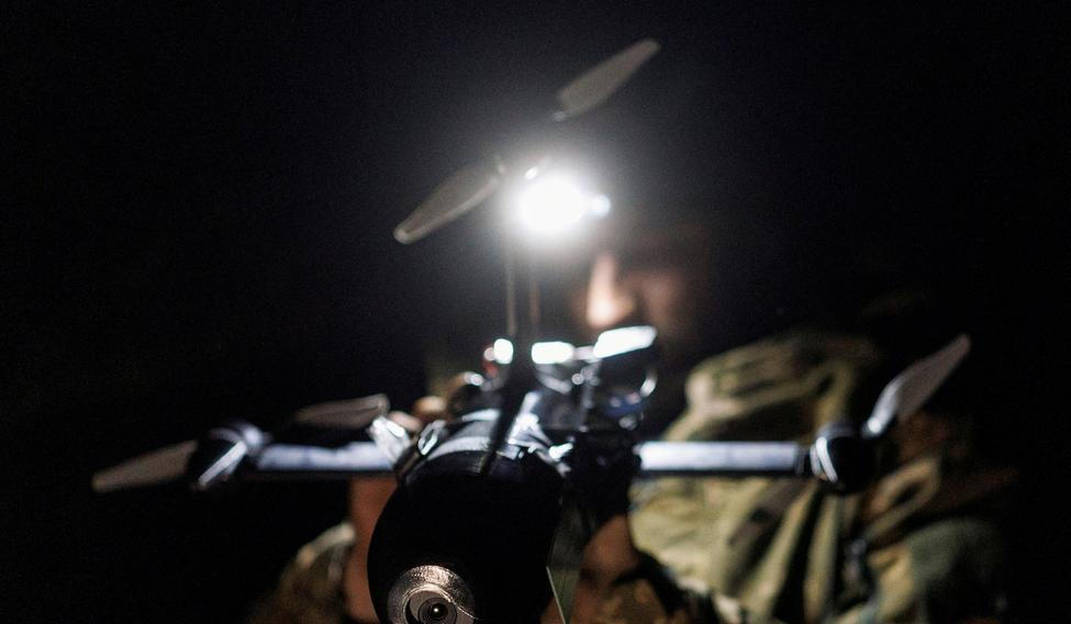 FILE PHOTO: Ukrainian serviceman prepares for a fly an FPV interceptor drone during his combat shift in Kharkiv region