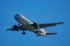 FILE PHOTO: A Frontier Airlines plane approaches Ronald Reagan Washington National Airport