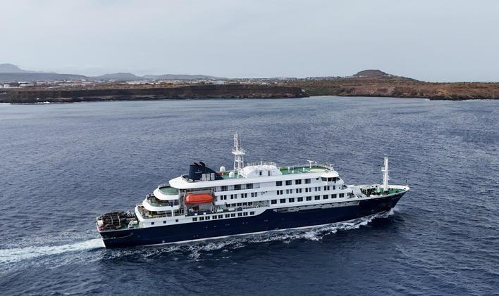 A drone view of the cruise ship MV Hondius, carrying passengers suspected of having cases of hantavirus on board, leaves Praia