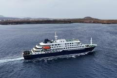 A drone view of the cruise ship MV Hondius, carrying passengers suspected of having cases of hantavirus on board, leaves Praia