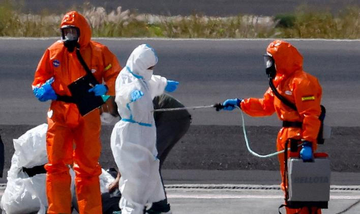 Passengers of the cruise ship MV Hondius, which was affected by a hantavirus outbreak, arrive at Tenerife Sud airport