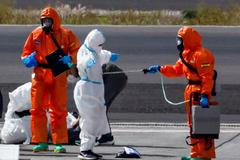 Passengers of the cruise ship MV Hondius, which was affected by a hantavirus outbreak, arrive at Tenerife Sud airport