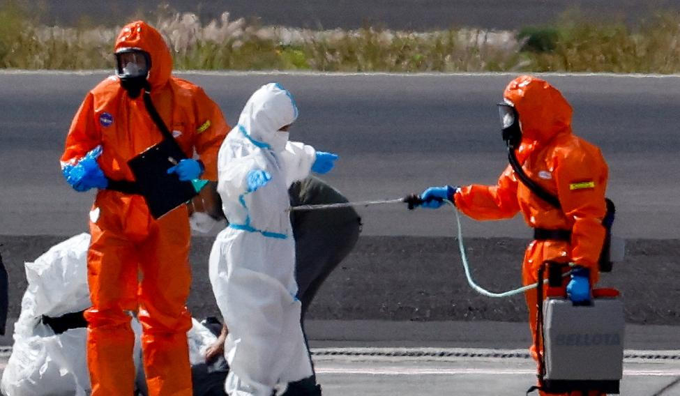 Passengers of the cruise ship MV Hondius, which was affected by a hantavirus outbreak, arrive at Tenerife Sud airport