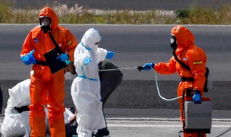 Passengers of the cruise ship MV Hondius, which was affected by a hantavirus outbreak, arrive at Tenerife Sud airport