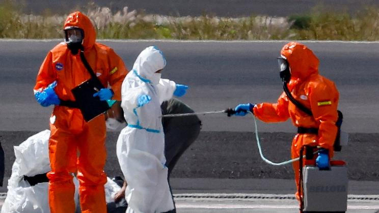 Passengers of the cruise ship MV Hondius, which was affected by a hantavirus outbreak, arrive at Tenerife Sud airport