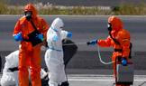 Passengers of the cruise ship MV Hondius, which was affected by a hantavirus outbreak, arrive at Tenerife Sud airport