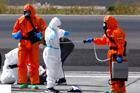 Passengers of the cruise ship MV Hondius, which was affected by a hantavirus outbreak, arrive at Tenerife Sud airport
