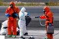 Passengers of the cruise ship MV Hondius, which was affected by a hantavirus outbreak, arrive at Tenerife Sud airport