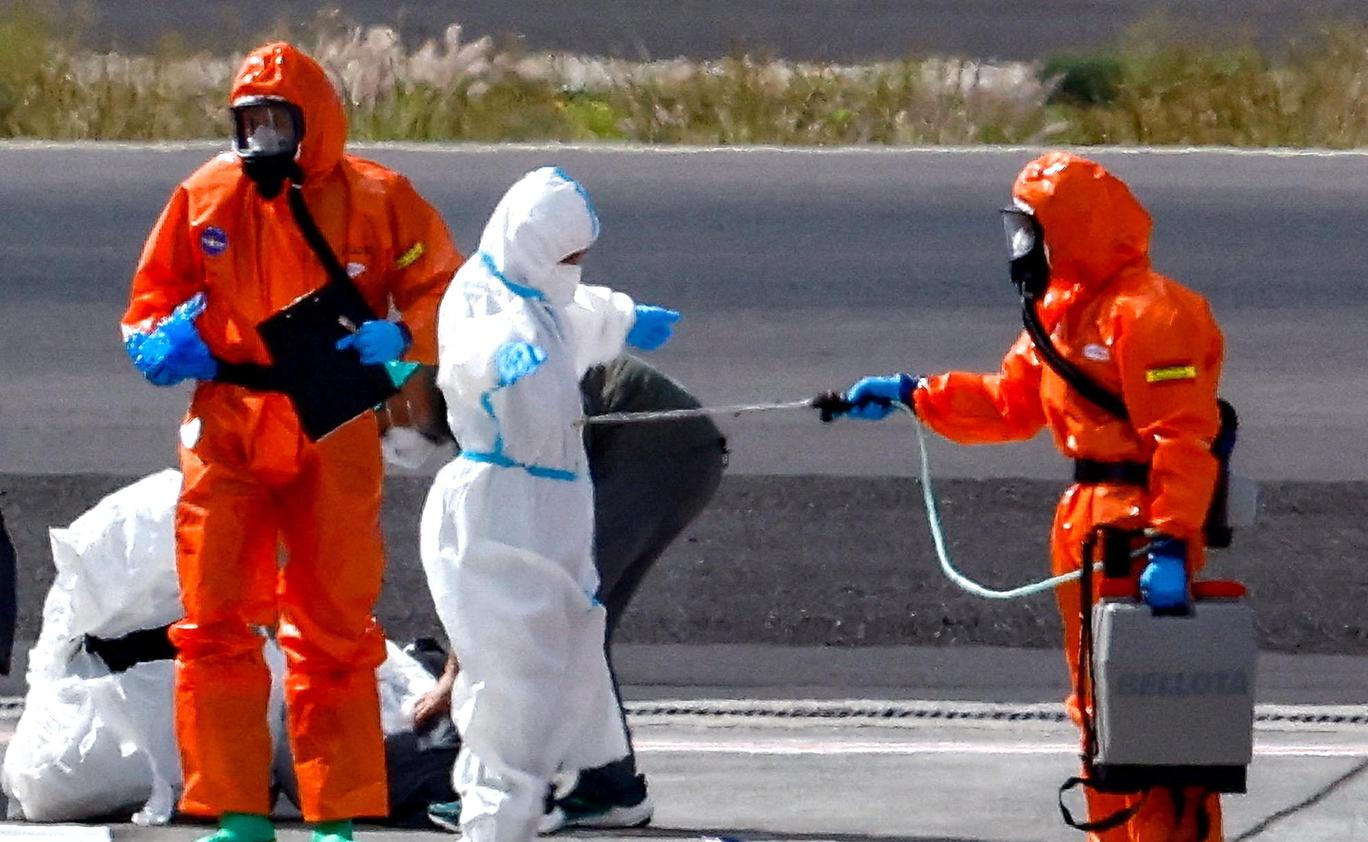 Passengers of the cruise ship MV Hondius, which was affected by a hantavirus outbreak, arrive at Tenerife Sud airport