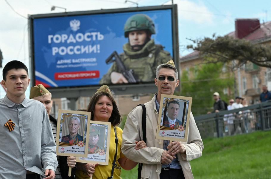 People attend the Immortal Regiment march on Victory Day in Omsk