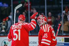 Útočník Austin Watson a brankář Michal Postava v dresu Grand Rapids Griffins