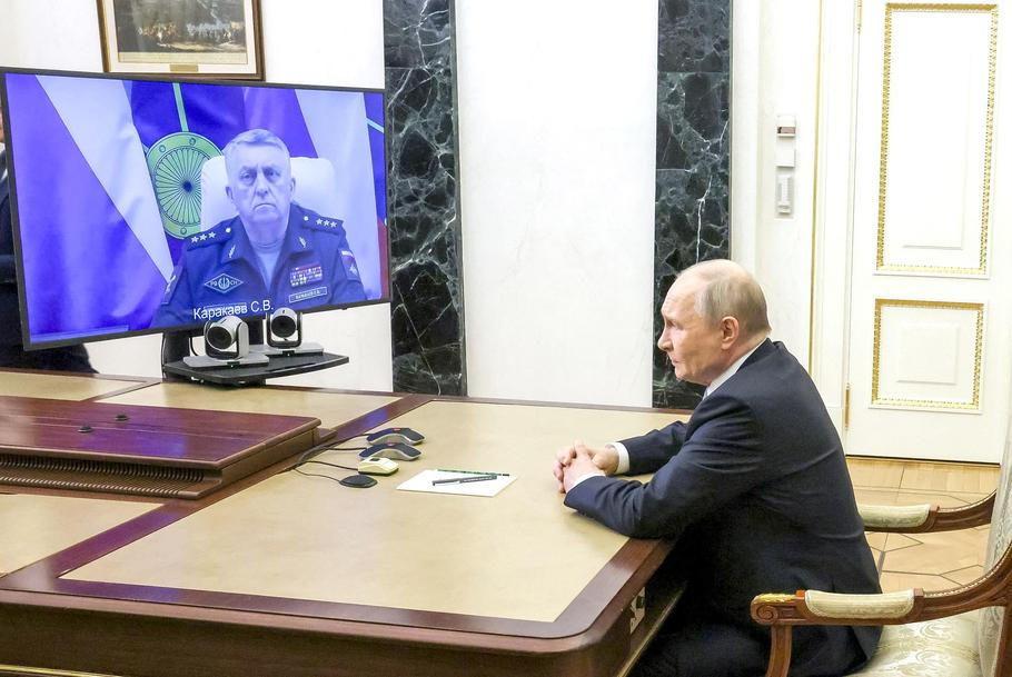 Russian President Vladimir Putin meets with Commander of the Russian Strategic Missile Forces Colonel General Sergei Karakayev via video link in Moscow