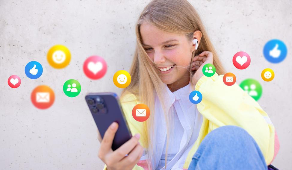 Teenage,Girl,Using,Social,Media,Apps,On,Mobile,Phone