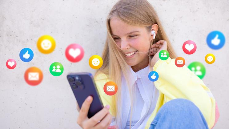 Teenage,Girl,Using,Social,Media,Apps,On,Mobile,Phone