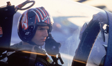Tom Cruise coby pilot Maverick ve filmu Top Gun (1986).