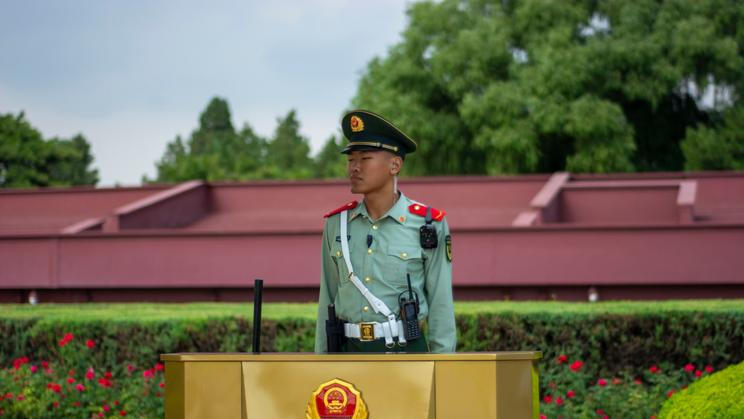Armed,Police,Officers,Stand,Guard,At,Tiananmen,Square,In,Beijing,