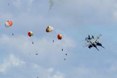 Military jets' crew members eject safely following a mid-air collision during the Idaho air show outside Mountain Home Air Force Base in Idaho