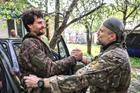 Ukrainian servicemen return from positions near the frontline in Kharkiv region