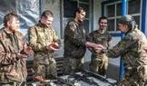 Ukrainian servicemen return from positions near the frontline in Kharkiv region