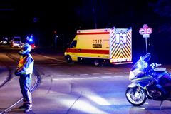 An ambulance believed to be carrying an American health worker, who has been brought to Germany for treatment after contracting Ebola in the Democratic Republic of Congo, arrives at the Charite University Hospital in Berlin