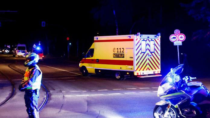 An ambulance believed to be carrying an American health worker, who has been brought to Germany for treatment after contracting Ebola in the Democratic Republic of Congo, arrives at the Charite University Hospital in Berlin