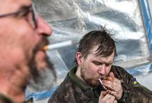 Ukrainian servicemen return from positions near the frontline in Kharkiv region