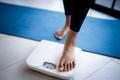 Lose,Weight.,Fat,Diet,And,Scale,Feet,Standing,On,Electronic