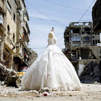 Gaza brides turn to refurbish old wedding dresses amid soaring prices and shortages