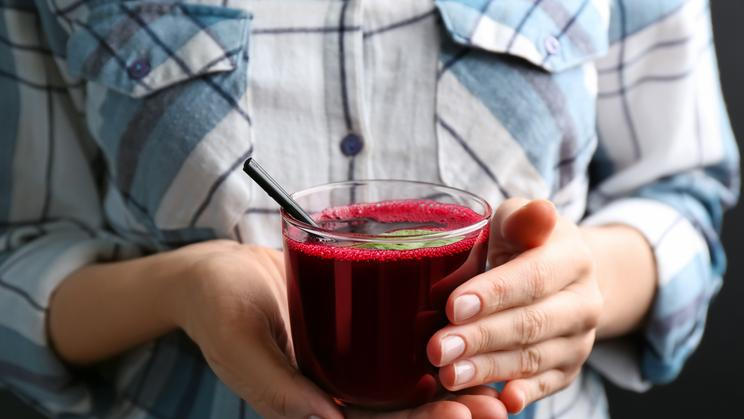 Woman,With,Glass,Of,Fresh,Beet,Juice,,Closeup