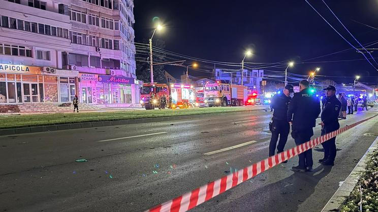 Firefighters and law enforcement work on the site of an explosion at a residential block of flats following a drone hit close to the border with Ukraine
