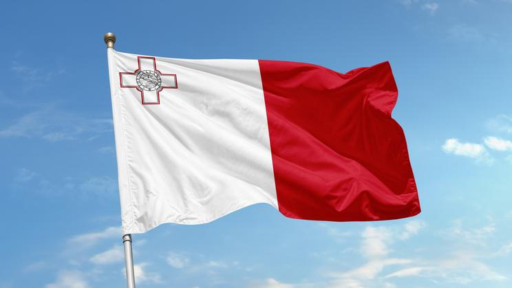 The,Flag,Of,Malta,Is,Shown,Waving,In,The,Wind,