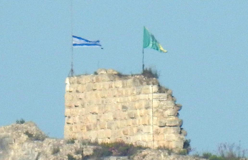 An Israeli flag and a flag of the Golani Brigade are raised on Beaufort Castle, as seen from Marjayoun