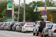 Cars queue for fuel at a gas station in Saki
