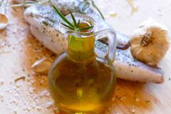 Fresh,Fish,And,Olive,Oil,In,The,Bottle,With,Herbs