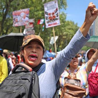 Teachers from Mexico's CNTE union march for higher wages, in Mexico City