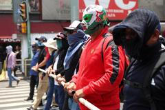 Teachers from Mexico's CNTE union march for higher wages, in Mexico City