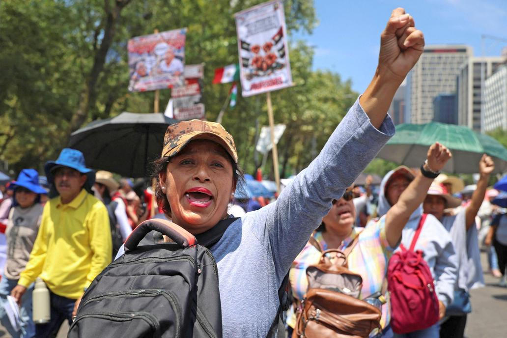Teachers from Mexico's CNTE union march for higher wages, in Mexico City