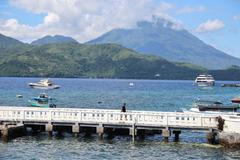 A man walks on a bridge after the Meteorology, Climatology, and Geophysical agency issued a tsunami warning in Ternate