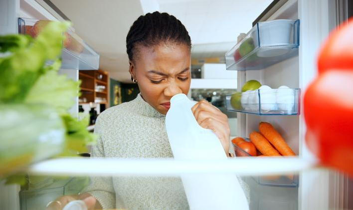 Black,Woman,,Fridge,Or,Smell,With,Expired,Milk,At,House