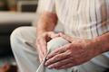 House,,Hands,And,Old,Man,On,Couch,,Knee,Pain,And