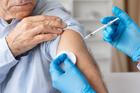 Senior,Male,Patient,Receiving,Vaccine,Injection,From,Healthcare,Professional