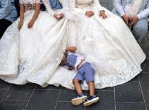 Lebanese groom Hassan Jawad, 22, bride Zainab Khawaja, 20, pose in wedding attire for photos in downtown Beirut