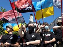 Protesters march denouncing an LGBT+ event in Kyiv