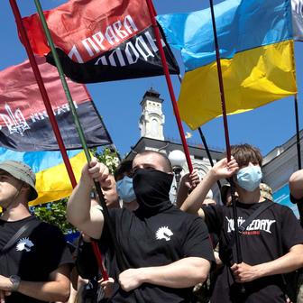 Protesters march denouncing an LGBT+ event in Kyiv
