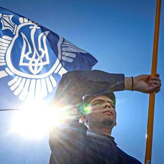 Protesters march denouncing an LGBT+ event in Kyiv
