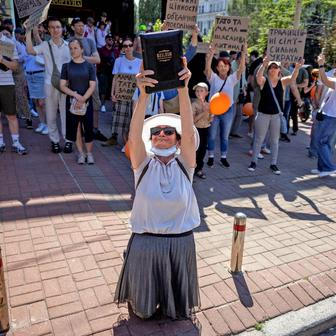 Protesters march denouncing an LGBT+ event in Kyiv