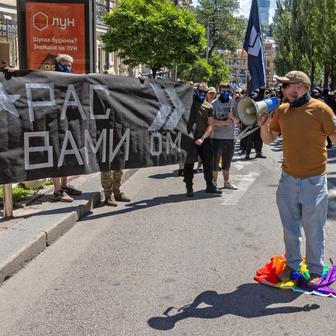 Protesters march denouncing an LGBT+ event in Kyiv