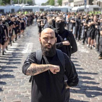 Protesters march denouncing an LGBT+ event in Kyiv