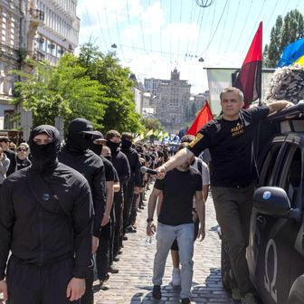 Protesters march denouncing an LGBT+ event in Kyiv