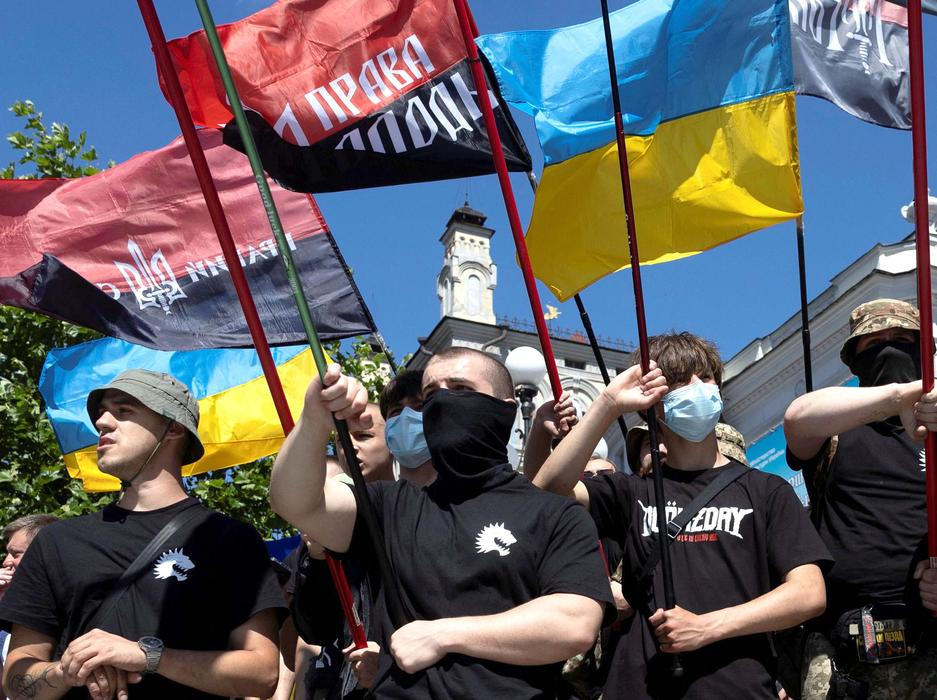 Protesters march denouncing an LGBT+ event in Kyiv
